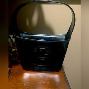 Authentic Gucci black leather GG Logo Handbag.